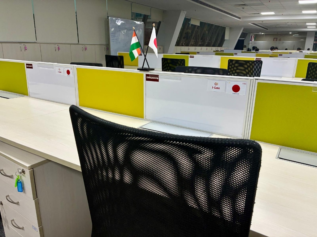 Dedicated desk with Japan and India flags, lockable drawer unit